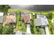Aerial view of the property showcasing the pool, backyard, and serene lake view at 344 Blue Bayou Dr, Kissimmee, FL 34743