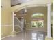 Elegant foyer with soaring ceilings, showcasing staircase and natural light at 344 Blue Bayou Dr, Kissimmee, FL 34743