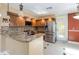 Updated kitchen with granite countertops, stainless steel appliances, and tiled backsplash at 344 Blue Bayou Dr, Kissimmee, FL 34743