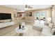 Open-concept living space with a kitchen and access to an outdoor patio at 344 Blue Bayou Dr, Kissimmee, FL 34743