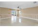 Open living area featuring a sliding glass door and tile flooring at 344 Blue Bayou Dr, Kissimmee, FL 34743