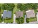 This aerial view shows a charming single-Gathering home with a well-maintained lawn and mature trees at 36646 Oconee Ave, Eustis, FL 32736