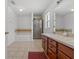 A bathroom featuring a soaking tub, a glass-door shower, and a vanity sink with storage underneath at 36646 Oconee Ave, Eustis, FL 32736