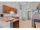 Practical kitchen featuring wood cabinets, laminate counters, and stainless steel appliances with tile flooring at 36646 Oconee Ave, Eustis, FL 32736