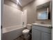 Modern bathroom featuring a tub/shower combination and a sleek vanity with storage at 3950 Alba Dr, Indian Lake Estates, FL 33855