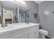 Bathroom featuring a double sink vanity, large mirror, and combined shower and tub at 4102 Plantation Cove Dr # 201, Orlando, FL 32810