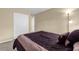 Bedroom featuring a spacious closet and comfortable bedding for a relaxing retreat at 4102 Plantation Cove Dr # 201, Orlando, FL 32810