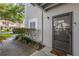 Charming condo front door with a storm door, decorative welcome mat, and unit number 4102 displayed at 4102 Plantation Cove Dr # 201, Orlando, FL 32810