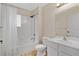 Bright bathroom with white cabinets, a tub, and a shower featuring a white shower curtain at 4600 Yellowgold W Rd # 102, Kissimmee, FL 34746