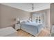 Cozy bedroom featuring a queen bed, white furnishings, and natural light from a window at 4600 Yellowgold W Rd # 102, Kissimmee, FL 34746