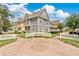 Charming townhomes with colorful exteriors, white picket fences, and a beautifully paved entrance at 4600 Yellowgold W Rd # 102, Kissimmee, FL 34746