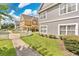 Attractive townhomes with well-manicured lawns, white picket fences, and landscaped greenery at 4600 Yellowgold W Rd # 102, Kissimmee, FL 34746