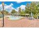 Community splash pad with water features, shaded seating, and tables for Gathering fun and relaxation at 4600 Yellowgold W Rd # 102, Kissimmee, FL 34746