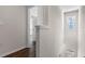 Upstairs hallway area featuring wood flooring and natural light at 4602 Linda Dr, Lake Wales, FL 33859