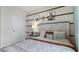 Comfortable bedroom with a rustic-style bed, decorative pillows, and stylish wall art at 4616 Linda Dr, Lake Wales, FL 33859