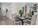 Bright dining area showcases a modern table setting, tiled floors, and a convenient, open layout at 4616 Linda Dr, Lake Wales, FL 33859