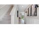 Bright hallway with staircase leading to upstairs and views of the outdoors at 4616 Linda Dr, Lake Wales, FL 33859