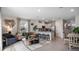 Open-concept living space with modern decor, a kitchen island, and stainless steel appliances at 4616 Linda Dr, Lake Wales, FL 33859