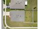 Aerial view of roof and backyard, featuring green grass and a privacy fence at 489 Panaro Ln, Haines City, FL 33844