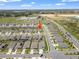 Aerial view of a home in a residential neighborhood with manicured lawns at 489 Panaro Ln, Haines City, FL 33844
