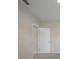 Hallway with access to bedrooms and bathrooms, featuring carpet flooring at 489 Panaro Ln, Haines City, FL 33844