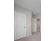 Hallway with access to bedrooms and bathrooms, featuring carpet flooring at 489 Panaro Ln, Haines City, FL 33844