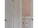 Hallway featuring view of bathroom sink and vanity at 489 Panaro Ln, Haines City, FL 33844