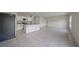 Bright kitchen features white cabinets, granite countertops, stainless steel appliances and a large island at 489 Panaro Ln, Haines City, FL 33844