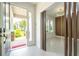 A bright foyer with modern fixtures, leading into a spacious area with ample natural light at 5161 Dove Tree St, Orlando, FL 32811