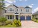 Charming two-story home with a brick paver driveway and manicured landscaping in a beautiful neighborhood at 5161 Dove Tree St, Orlando, FL 32811