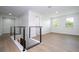 Upstairs hallway features cable railing and offers access to bedrooms at 5161 Dove Tree St, Orlando, FL 32811