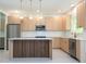 Bright, renovated kitchen featuring modern cabinetry, stainless steel appliances, and a center island at 5161 Dove Tree St, Orlando, FL 32811