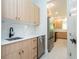 A modern kitchen with sleek cabinets, stainless steel appliances, and elegant backsplash, ready for cooking at 5161 Dove Tree St, Orlando, FL 32811