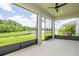 Screened lanai offers stunning views of the serene pond and lush greenery, enhancing outdoor living at 5161 Dove Tree St, Orlando, FL 32811