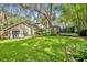 The well-manicured lawn and landscaping make this backyard a great place for activities at 5430 Baytowne Pl, Oviedo, FL 32765