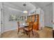 Cozy breakfast nook with a round table and natural light shining through the windows at 5430 Baytowne Pl, Oviedo, FL 32765