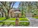 Attractive brick home with a manicured lawn and mailbox at 5430 Baytowne Pl, Oviedo, FL 32765