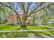 Beautiful brick house with an inviting front yard and mature shade trees at 5430 Baytowne Pl, Oviedo, FL 32765