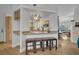 Modern kitchen with natural wood cabinets, granite counters and a view to adjoining room at 5430 Baytowne Pl, Oviedo, FL 32765