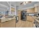 Bright kitchen featuring granite counters, stainless sink, recessed lights, and stainless appliances at 5430 Baytowne Pl, Oviedo, FL 32765