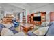 Comfortable living room open to dining area with stylish decor and lots of light at 5430 Baytowne Pl, Oviedo, FL 32765