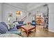 Spacious living room seamlessly connected to the dining area and staircase at 5430 Baytowne Pl, Oviedo, FL 32765