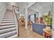 Open concept living area with staircase, wood floors, and abundant natural light at 5430 Baytowne Pl, Oviedo, FL 32765