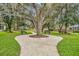 A neighborhood park featuring benches and shady trees provides a peaceful outdoor recreation area at 5430 Baytowne Pl, Oviedo, FL 32765