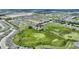 Aerial view of a neighborhood, highlighting a home bordering a lush green conservation area at 546 Windsor Pl, Davenport, FL 33896