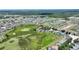 Panoramic aerial perspective of a neighborhood with homes bordering a greenbelt at 546 Windsor Pl, Davenport, FL 33896