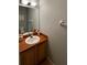 Half bathroom featuring a wood vanity, single sink and standard toilet at 546 Windsor Pl, Davenport, FL 33896