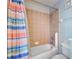 Bathroom featuring a shower with tiled walls at 546 Windsor Pl, Davenport, FL 33896