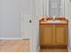 Bright bathroom featuring a wooden vanity with sink and neutral-toned flooring at 546 Windsor Pl, Davenport, FL 33896