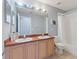 Bathroom with a vanity, mirror, tub, and shower at 546 Windsor Pl, Davenport, FL 33896